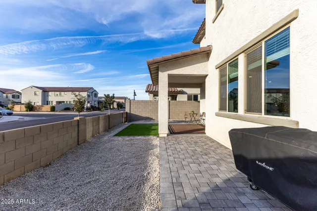 a bedroom with bed and a window