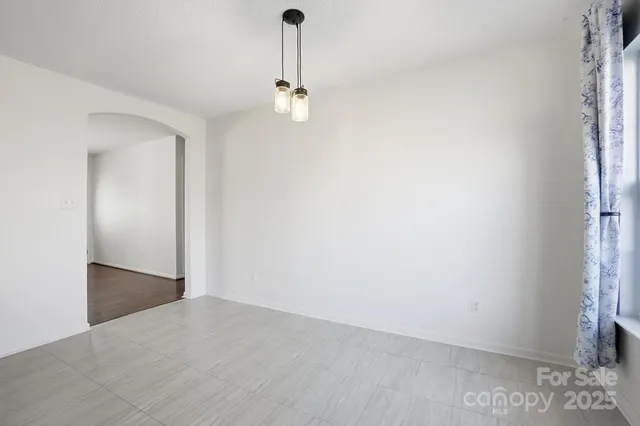 a view of a room with a sink and refrigerator