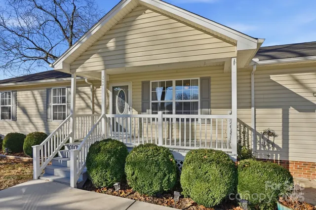 a view of a house with a small garden