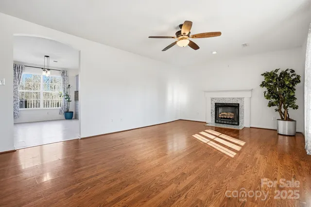 a view of livingroom with hardwood floor and a ceiling fan