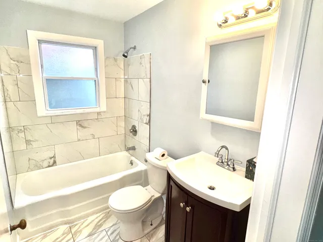 a bathroom with a sink and a bathtub