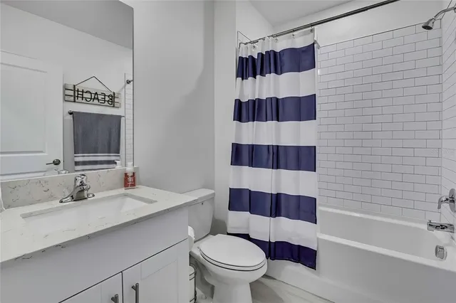 a bathroom with a double vanity sink and mirror