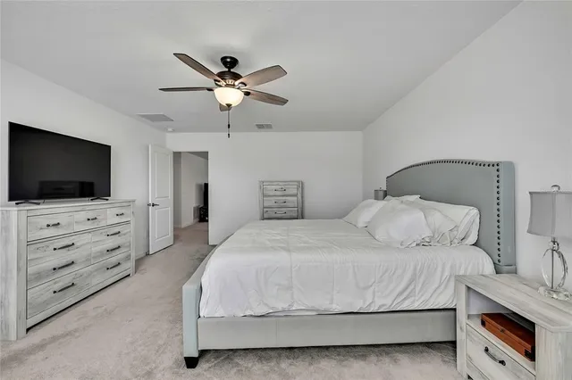 a bathroom with a double vanity sink a mirror and a bathtub