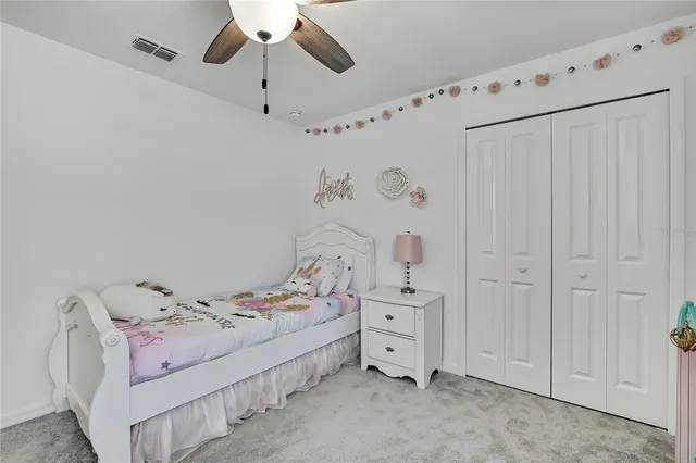 a view of a house with backyard porch and sitting area