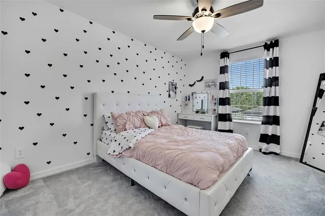 a front view of house with yard and car parked