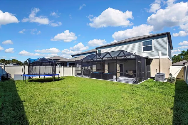 an aerial view of a house with a ocean view