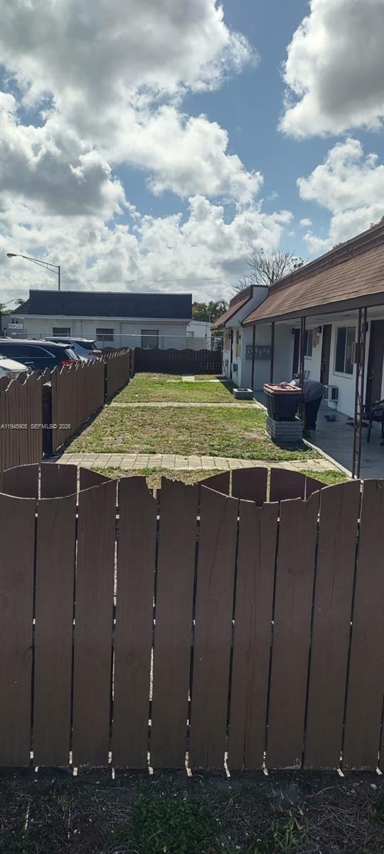 6321 Pembroke Road, Unit 6 Hollywood, FL 33023 - Photo 11 of 11 a view of a house with backyard and sitting area