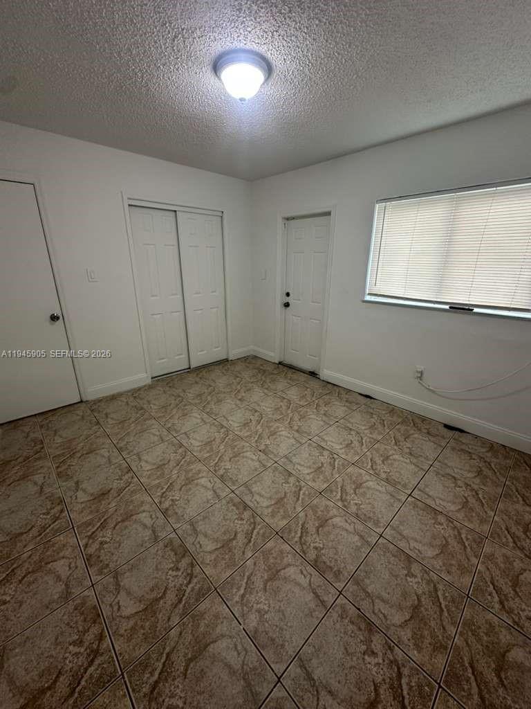 6321 Pembroke Road, Unit 6 Hollywood, FL 33023 - Photo 7 of 11 a view of an empty room