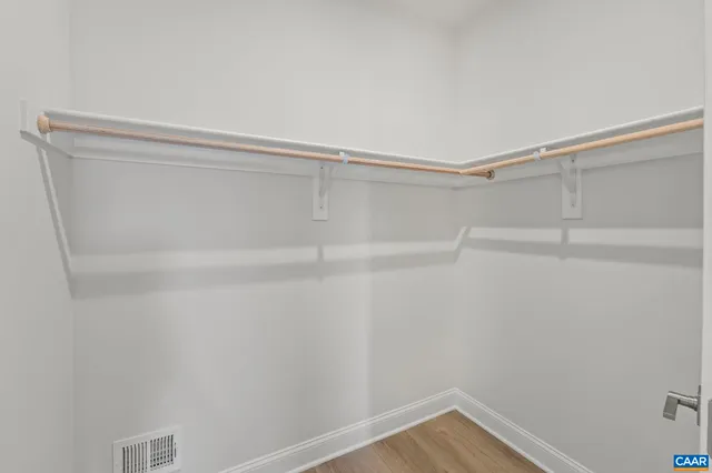 a view of cabinets and wooden floor