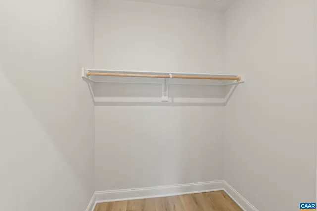 a view of an empty room with stairs