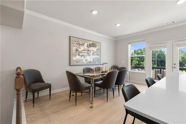 a large kitchen with a large counter top and stainless steel appliances