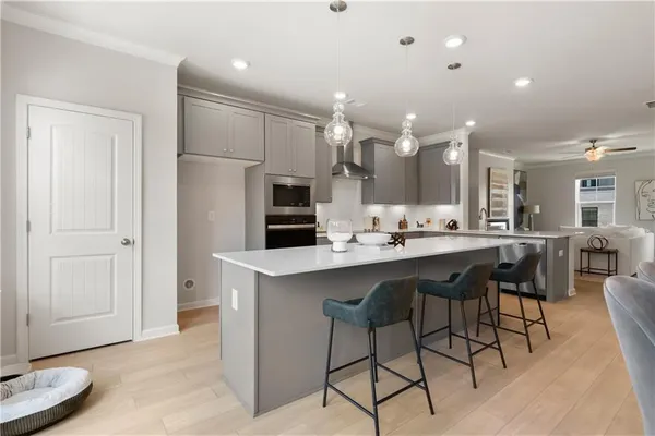 a large bathroom with a sink a large mirror and vanity