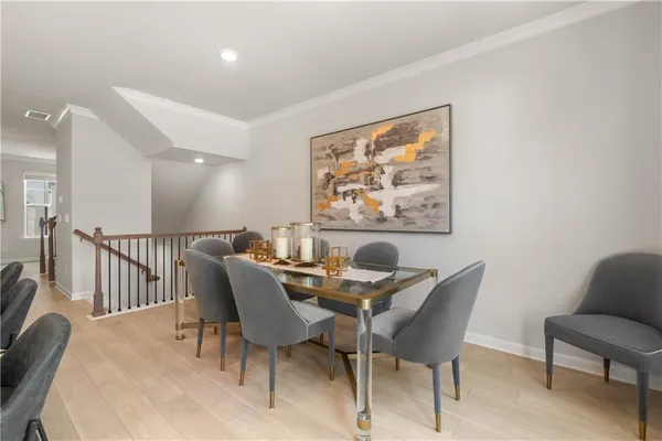 a kitchen with stainless steel appliances granite countertop a sink a counter space and a chandelier