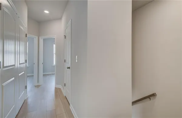 a view of a hallway with a white walls