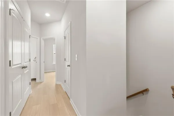 a bedroom with a bed and a mirror