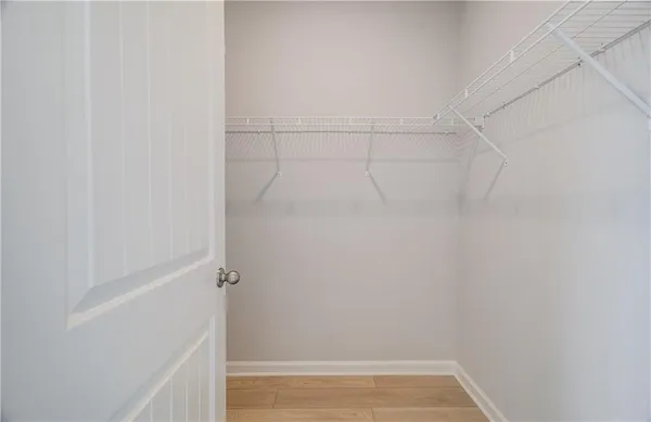 a bedroom with a bed and a closet