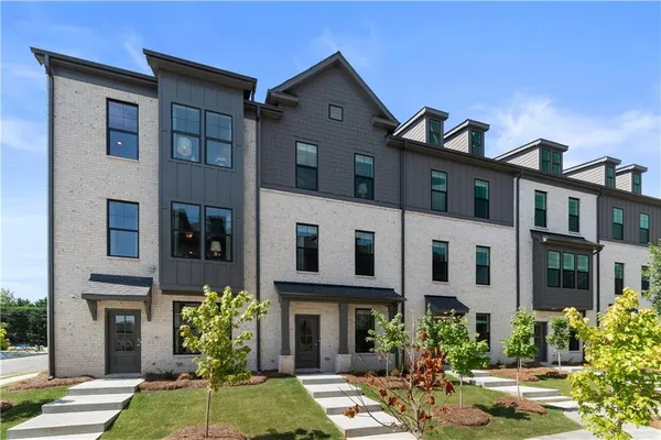 a living room with furniture and a entryway