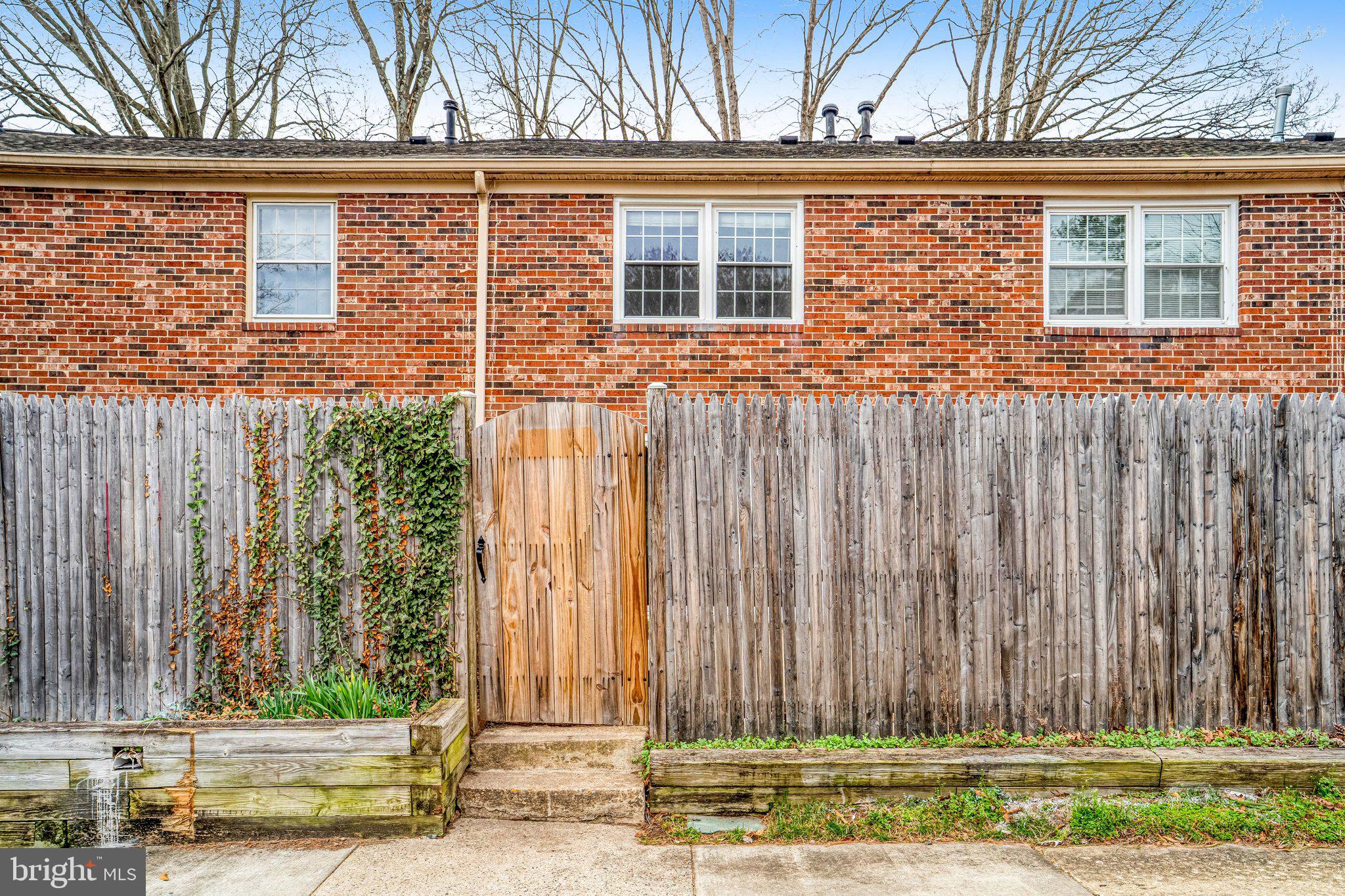 8396 Forrester Boulevard, Unit 555 Springfield, VA 22152 - Photo 24 of 24 a view of a brick house with a large windows