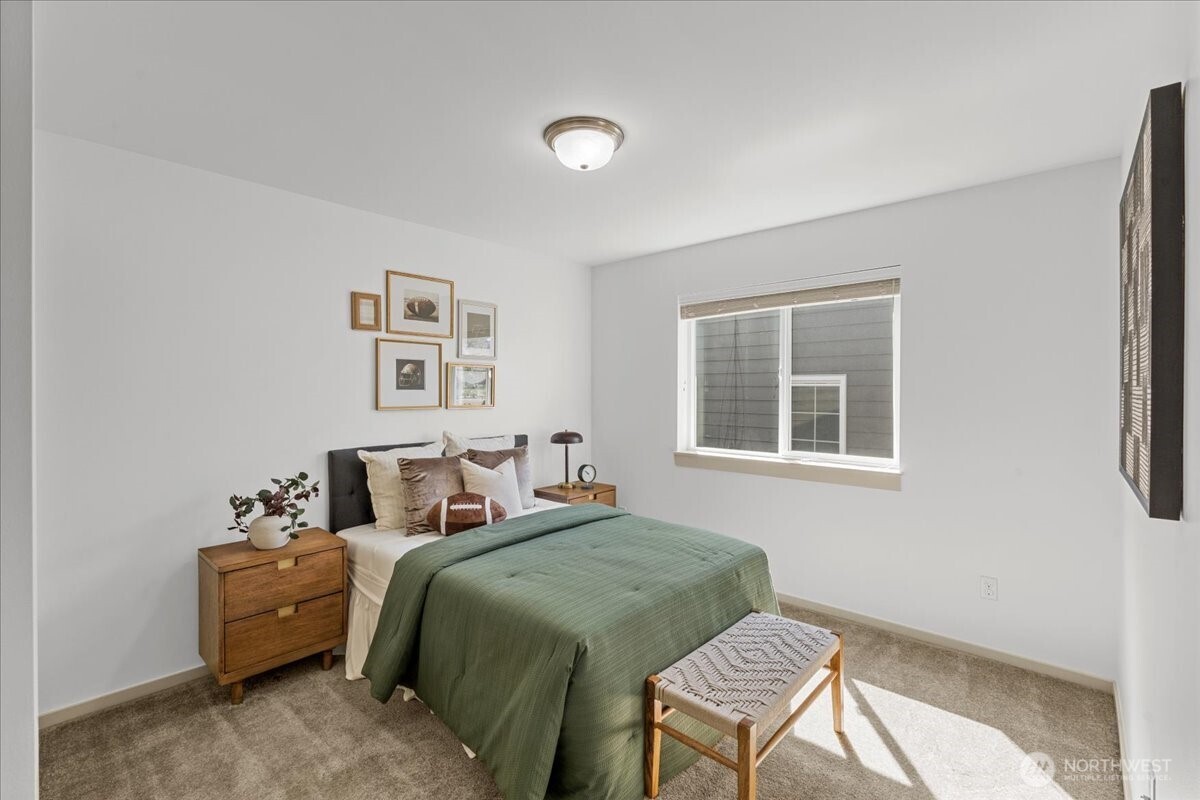 21720 39th Drive Southeast Bothell, WA 98021 - Photo 19 of 40 a bedroom with a bed and a chair