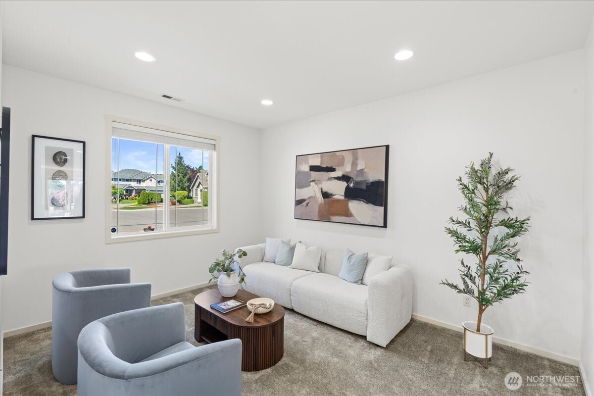 21720 39th Drive Southeast Bothell, WA 98021 - Photo 2 of 40 a living room with furniture and a potted plant