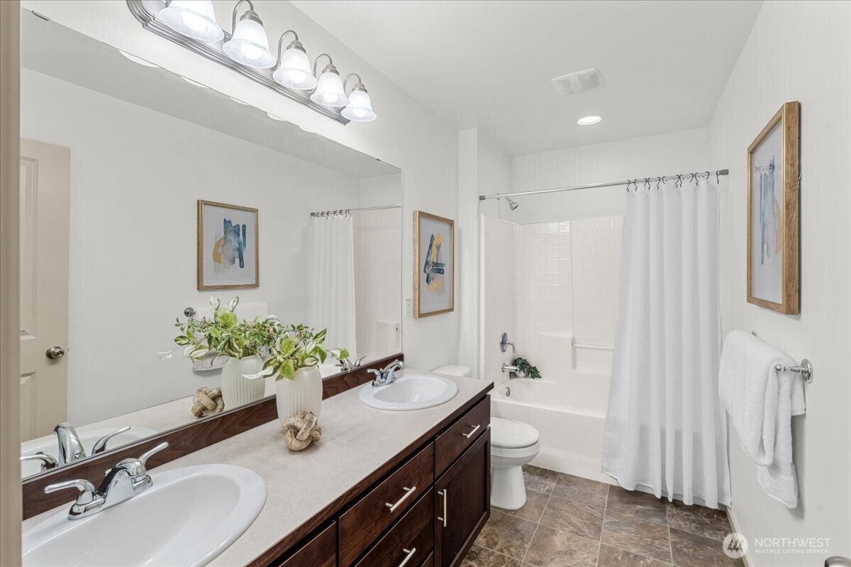 21720 39th Drive Southeast Bothell, WA 98021 - Photo 24 of 40 a bathroom with a double vanity sink mirror and toilet