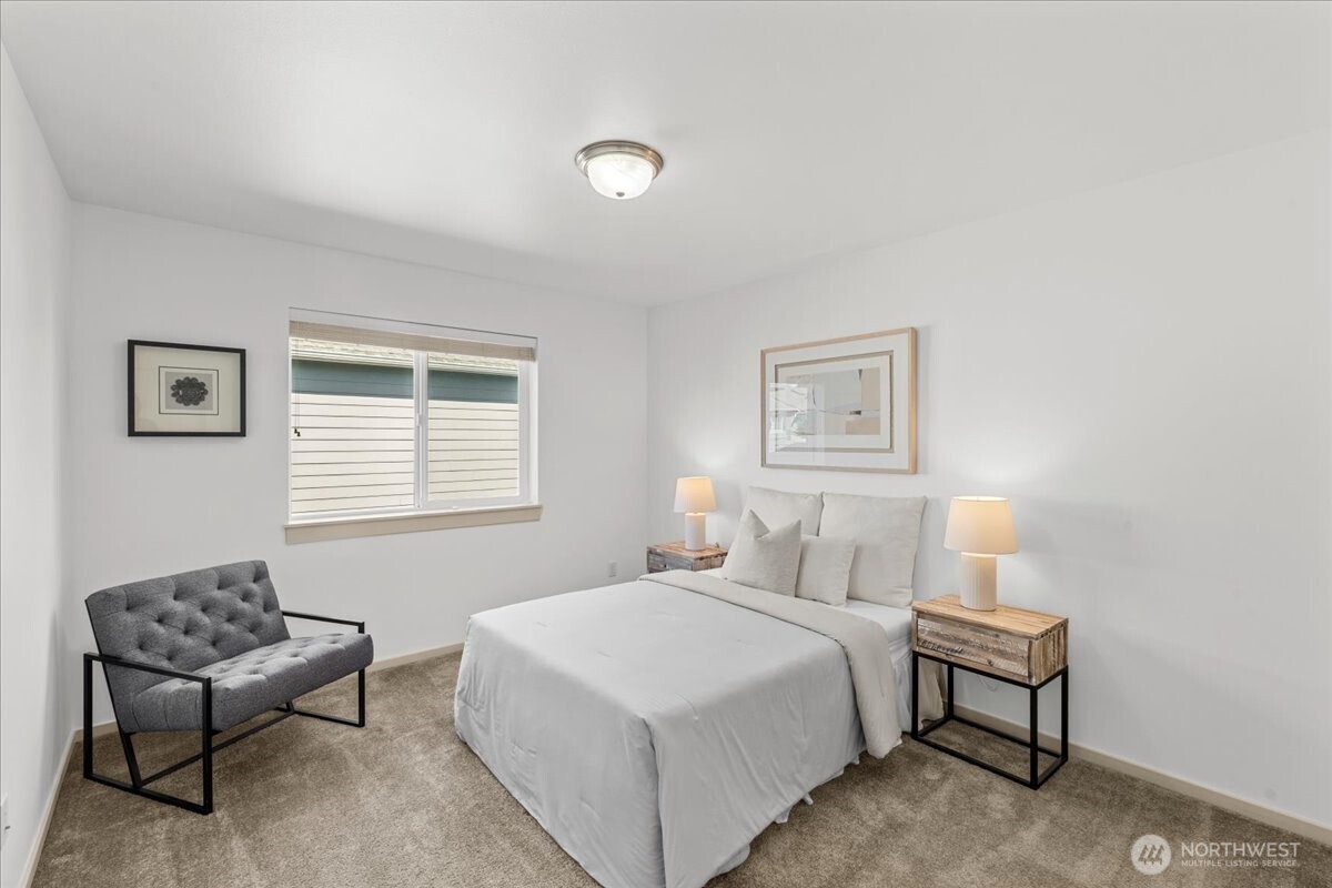 21720 39th Drive Southeast Bothell, WA 98021 - Photo 25 of 40 a bedroom with a bed and chair