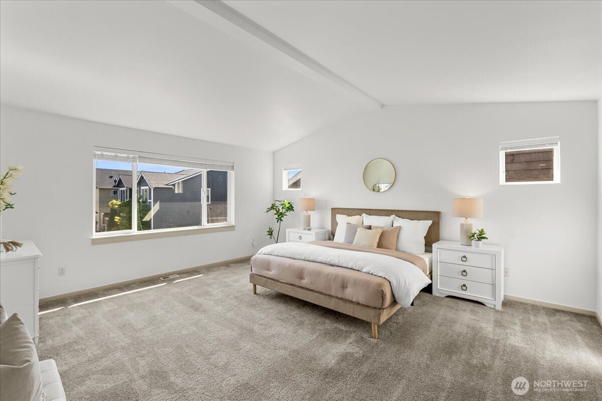 21720 39th Drive Southeast Bothell, WA 98021 - Photo 27 of 40 a spacious bedroom with a bed and a window