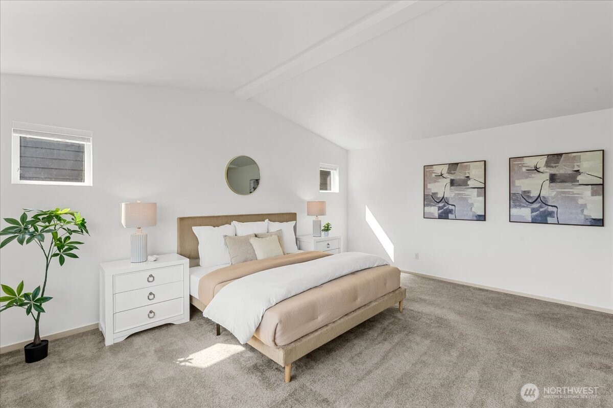 21720 39th Drive Southeast Bothell, WA 98021 - Photo 29 of 40 a bedroom with a bed and a potted plant