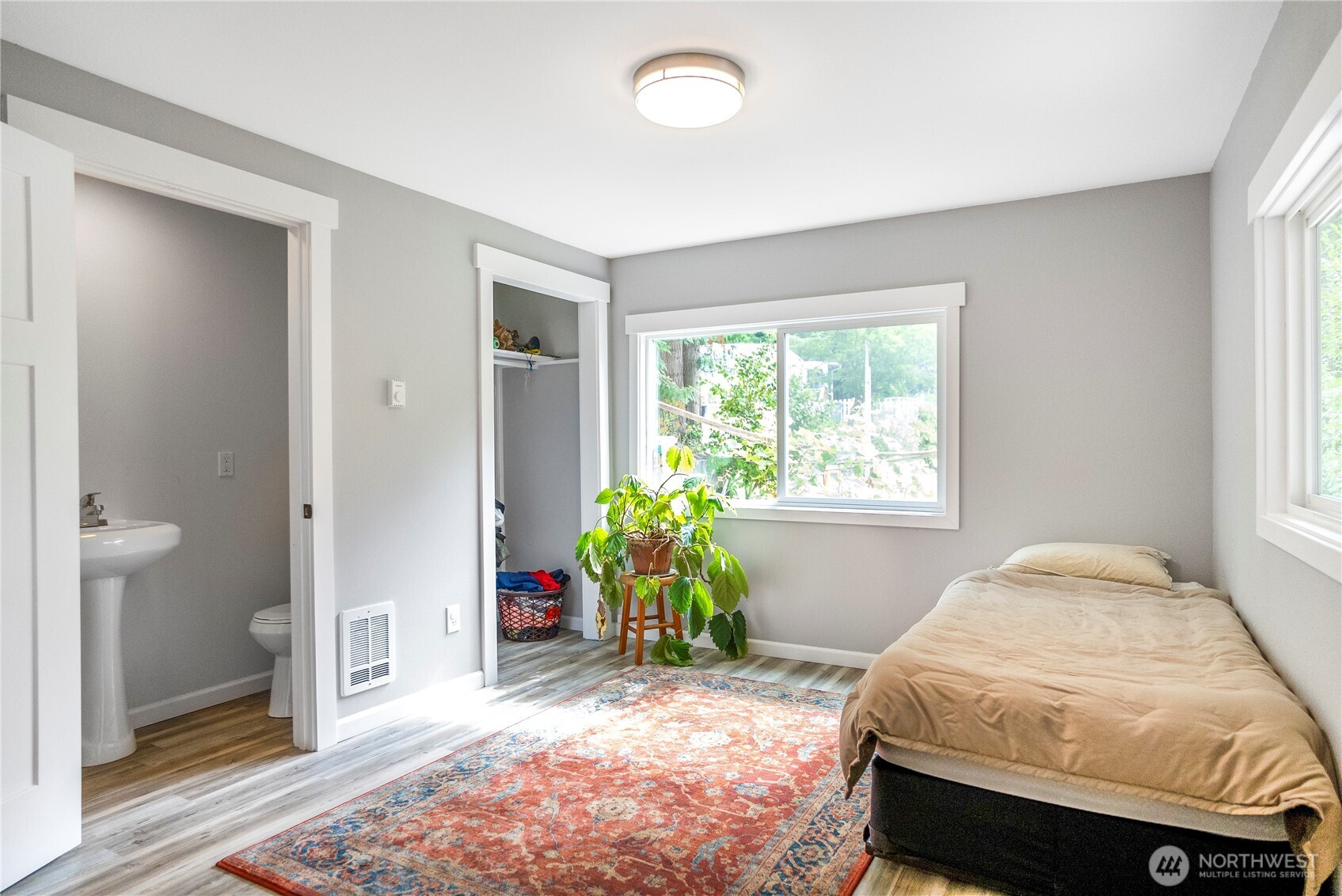 3333 228th Street Southeast, Unit 74 Bothell, WA 98021 - Photo 12 of 17 a bedroom with a bed and a window
