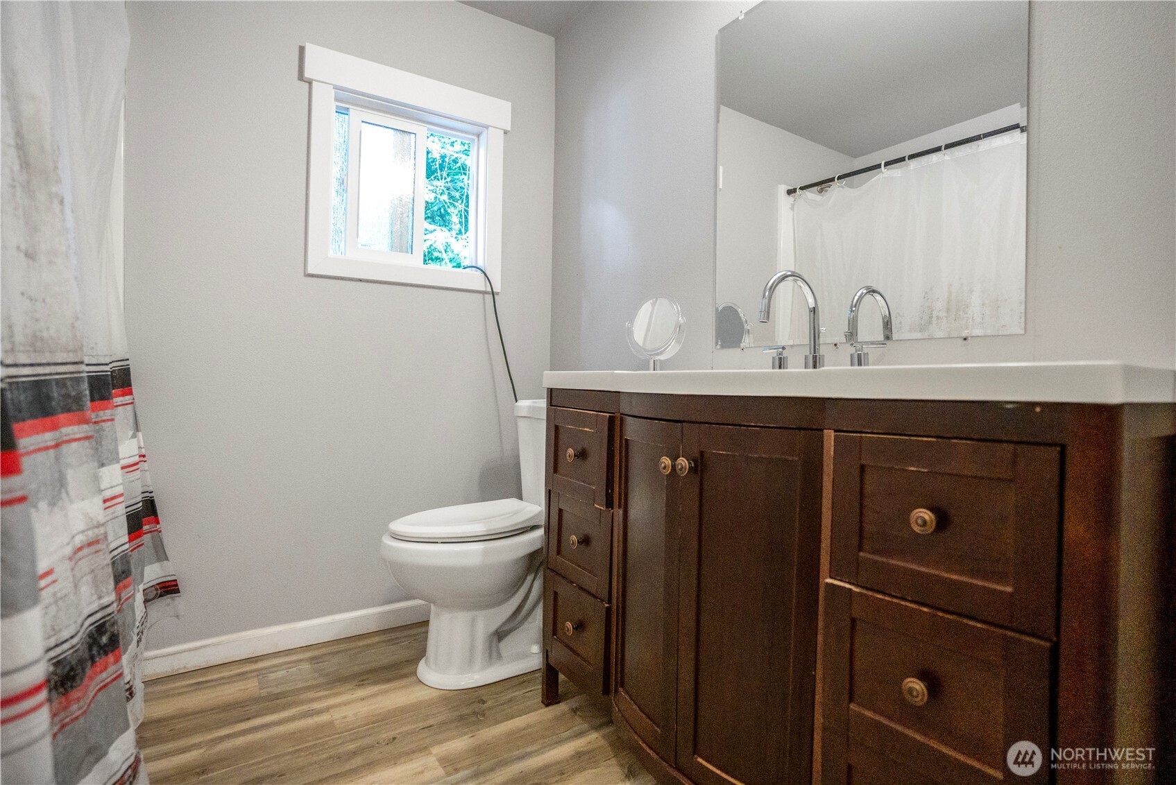 3333 228th Street Southeast, Unit 74 Bothell, WA 98021 - Photo 13 of 17 a bathroom with a toilet a sink and a window