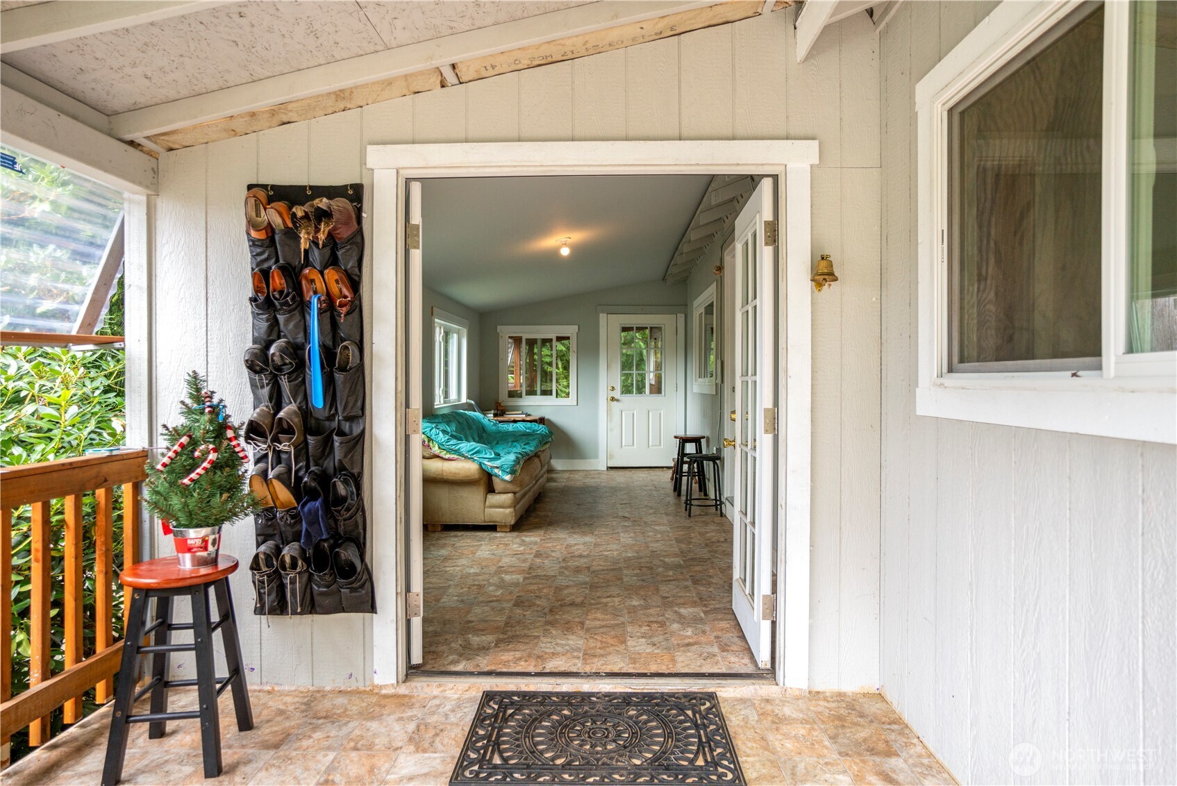 3333 228th Street Southeast, Unit 74 Bothell, WA 98021 - Photo 16 of 17 a view of a hallway with a potted plant and front door