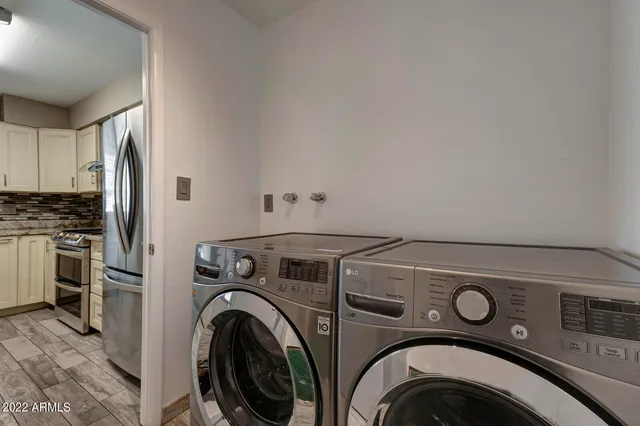 a utility room with dryer and washer