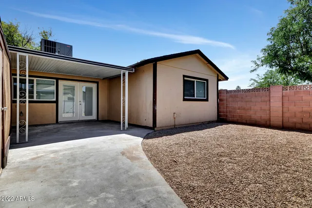 a house view with a backyard space