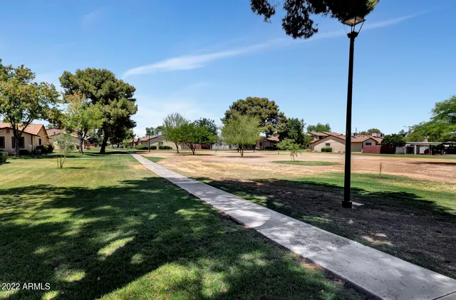 a view of a street with a park
