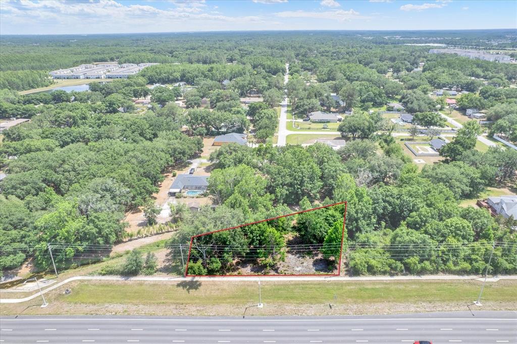 54 State Road Lutz, FL 33558 - Photo 3 of 10 an aerial view of residential houses with outdoor space and trees