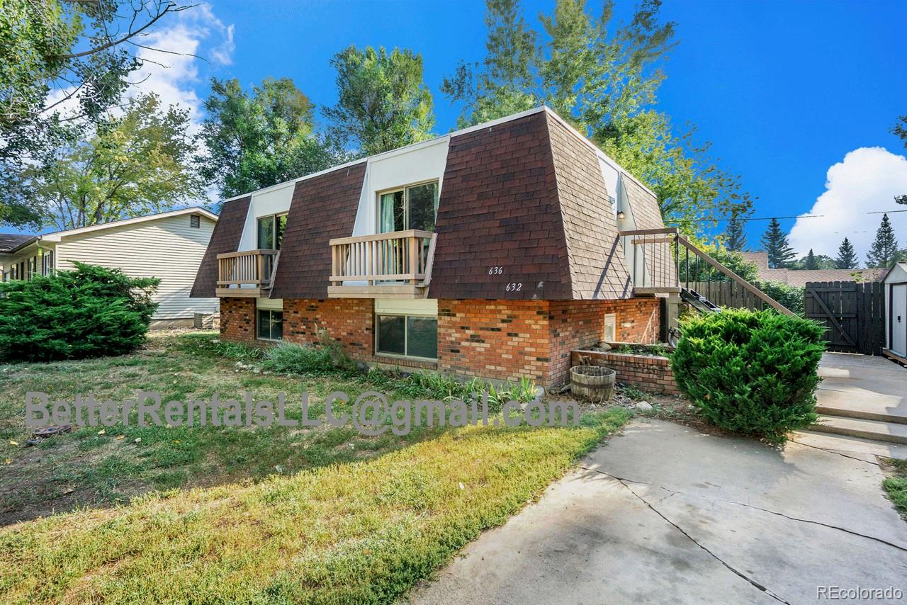 636 Irish Drive Fort Collins, CO 80521 - Photo 1 of 1 front view of a house with a yard