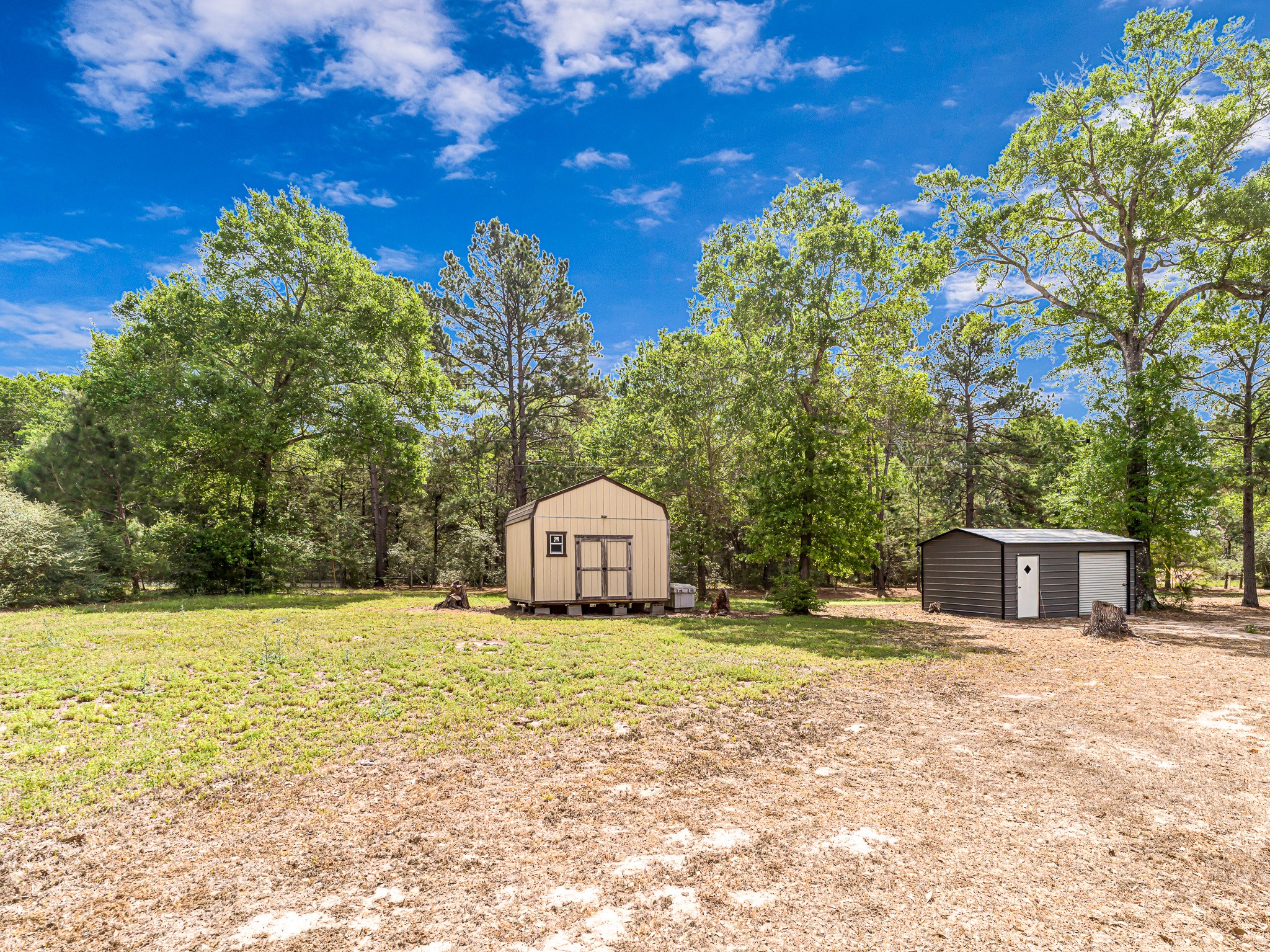 1047 Jimbob Lane New Ulm, TX 78950 - Photo 14 of 18 Barn shaped storage shed (14x12) and a well house (20x12) are conveniently located behind your new home. The well house has plenty of additional space for extra storage.