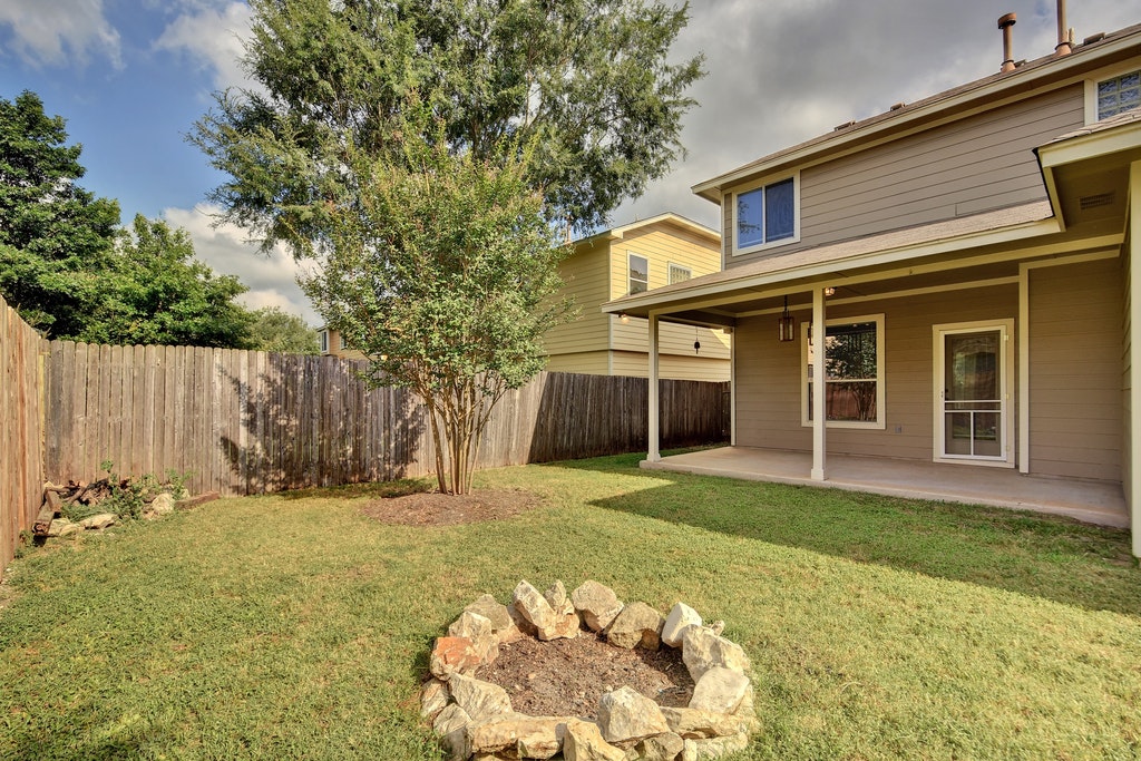 2201 Keepsake Drive Austin, TX 78745 - Photo 24 of 25 a front view of a house with a yard