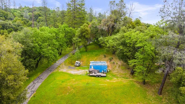 a living room with furniture cabinets and window