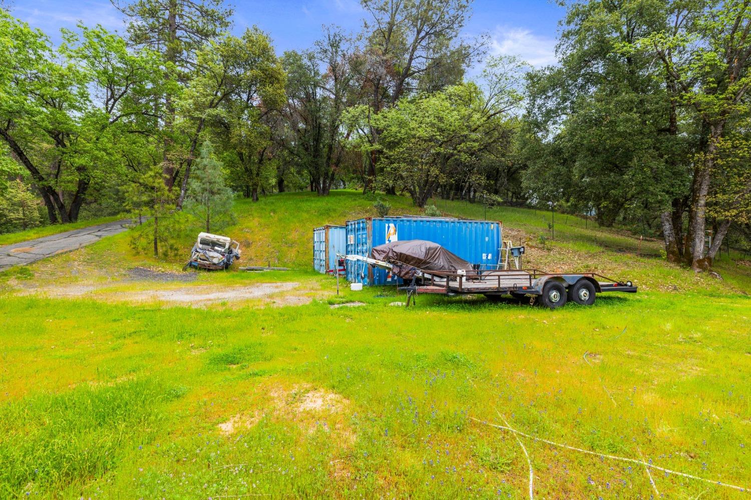 6432 Happy Valley Road Somerset, CA 95684 - Photo 18 of 90 a view of a swimming pool with lawn chairs and plants