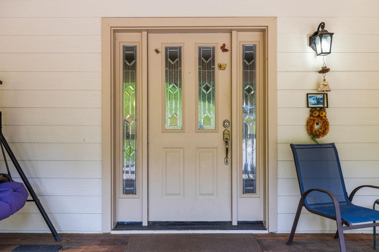 6432 Happy Valley Road Somerset, CA 95684 - Photo 27 of 90 a view of a hallway with entryway wooden floor and front door