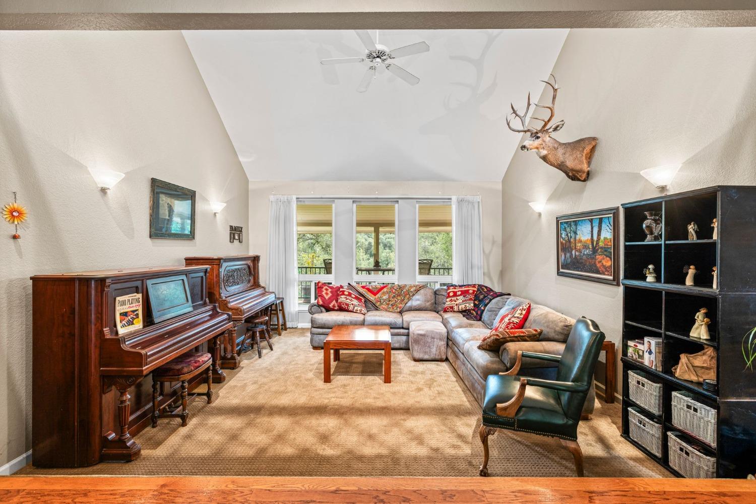 6432 Happy Valley Road Somerset, CA 95684 - Photo 29 of 90 a living room with furniture cabinets and window