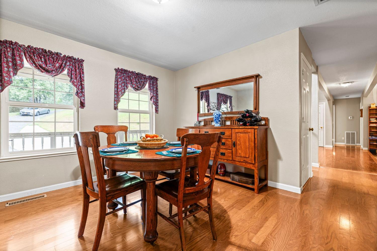 6432 Happy Valley Road Somerset, CA 95684 - Photo 32 of 90 a view of a dining room with furniture and wooden floor