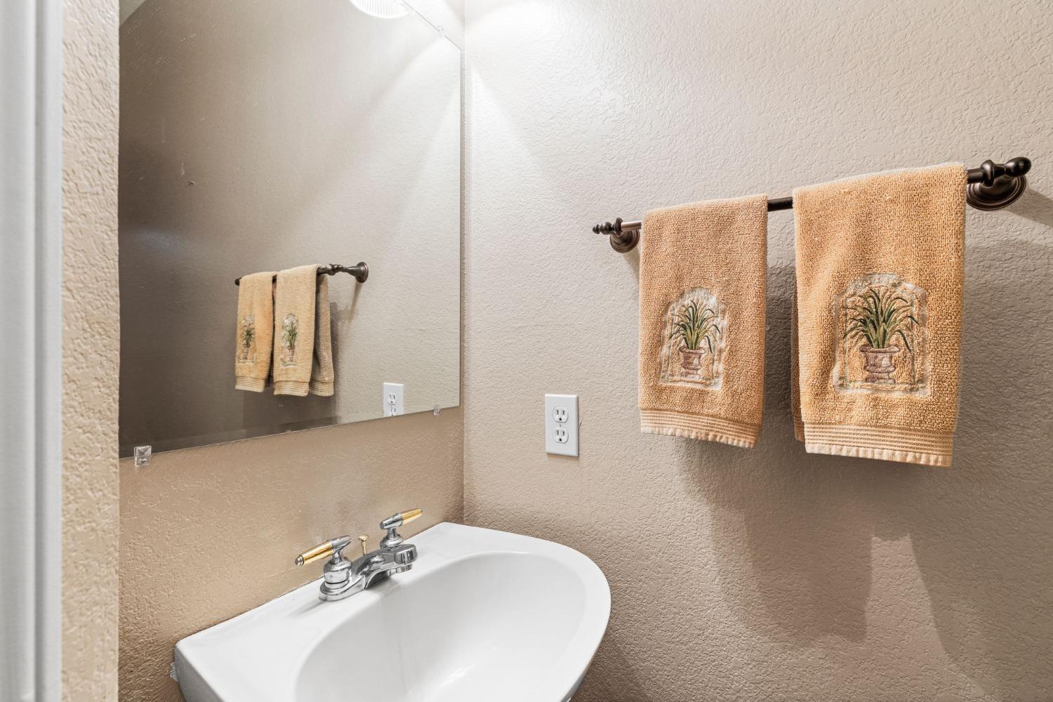 6432 Happy Valley Road Somerset, CA 95684 - Photo 34 of 90 a bathroom with a sink and a mirror