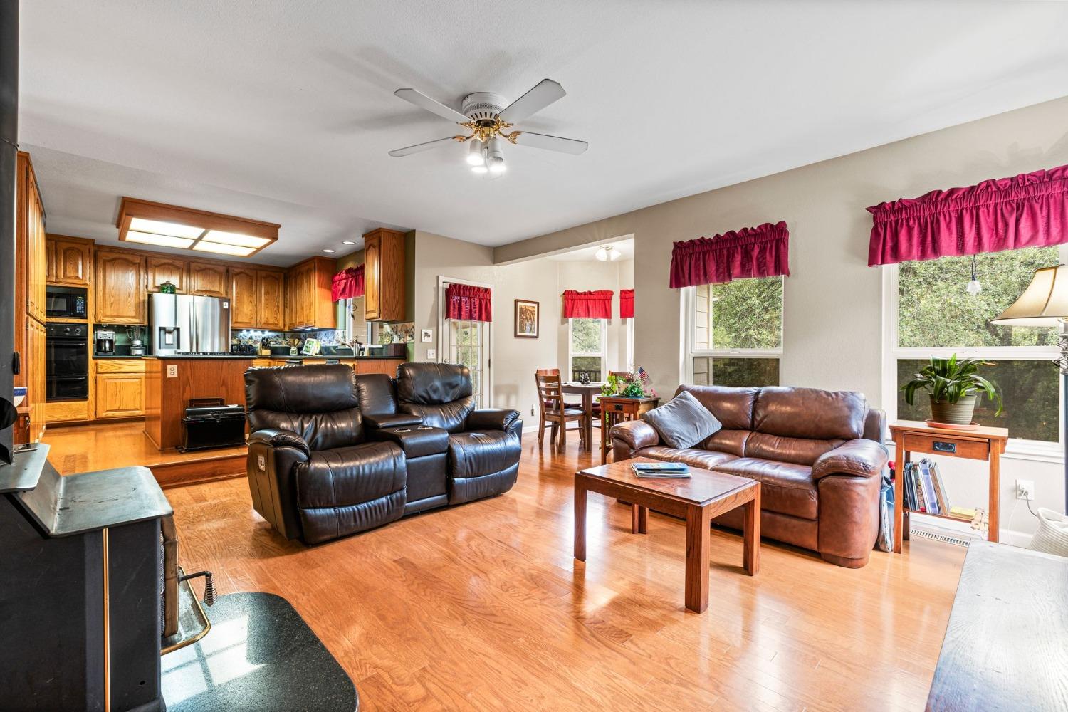 6432 Happy Valley Road Somerset, CA 95684 - Photo 36 of 90 a living room with fireplace furniture and a large window