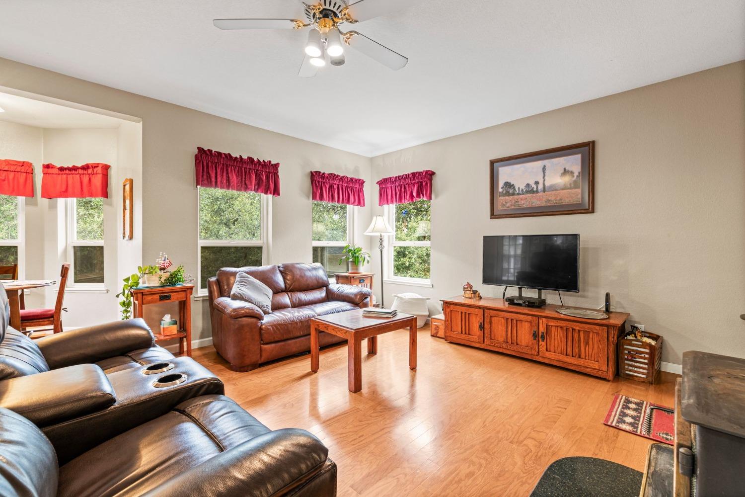 6432 Happy Valley Road Somerset, CA 95684 - Photo 38 of 90 a living room with furniture and a flat screen tv