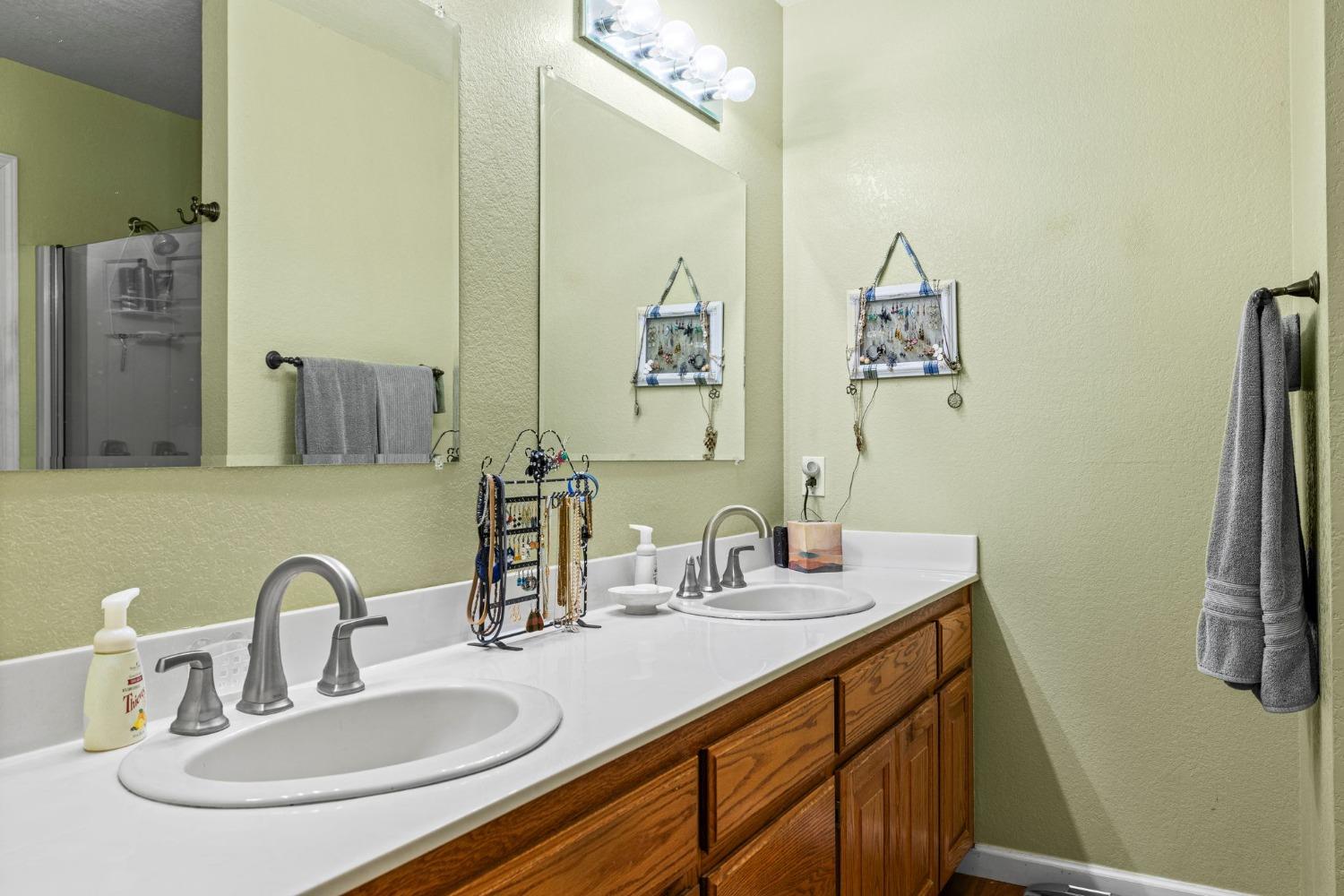 6432 Happy Valley Road Somerset, CA 95684 - Photo 54 of 90 a bathroom with a sink and a mirror