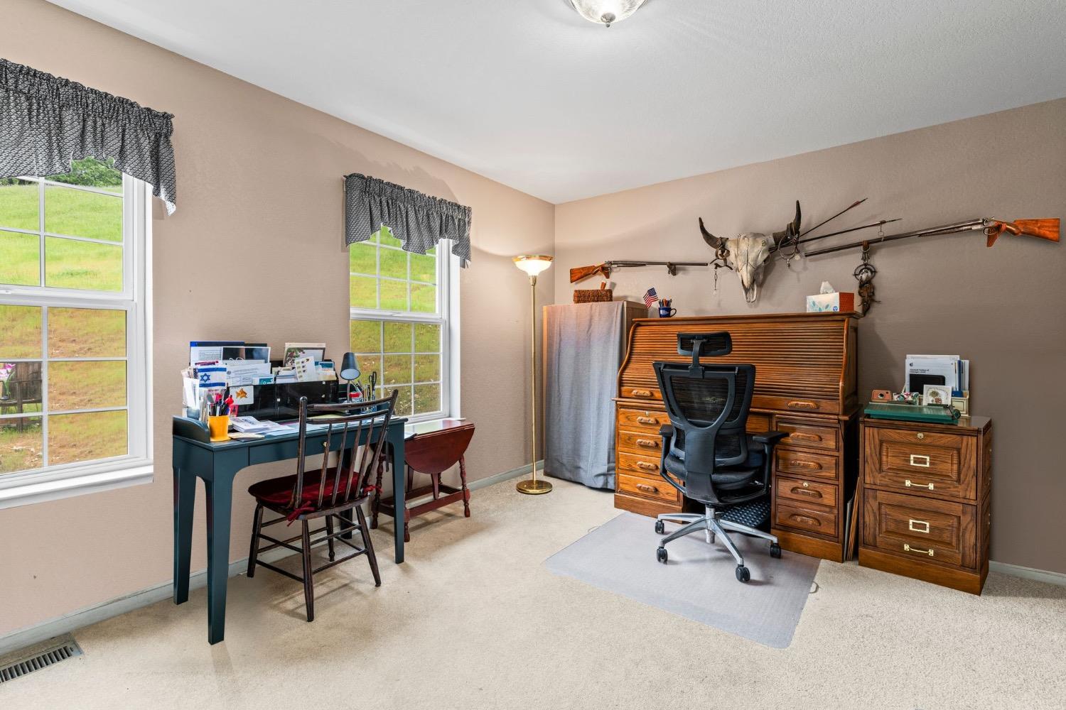 6432 Happy Valley Road Somerset, CA 95684 - Photo 60 of 90 a view of a workspace with furniture and a window