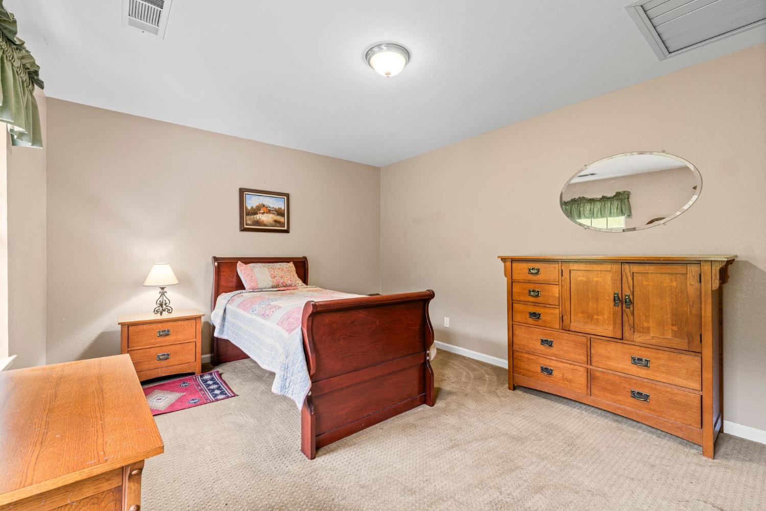 6432 Happy Valley Road Somerset, CA 95684 - Photo 67 of 90 a bedroom with a bed and a dresser