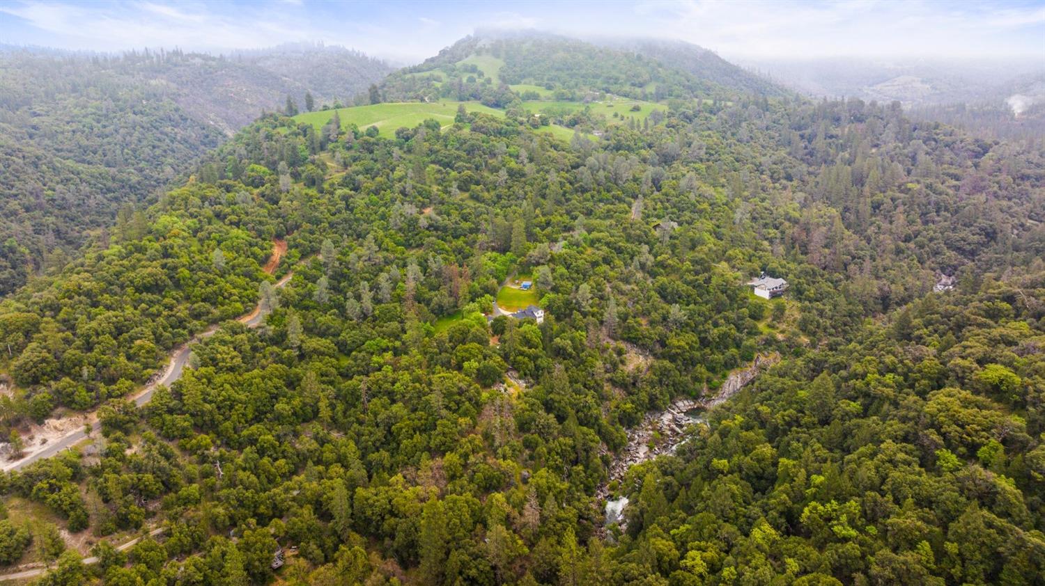 6432 Happy Valley Road Somerset, CA 95684 - Photo 86 of 90 a view of a big yard with lots of bushes